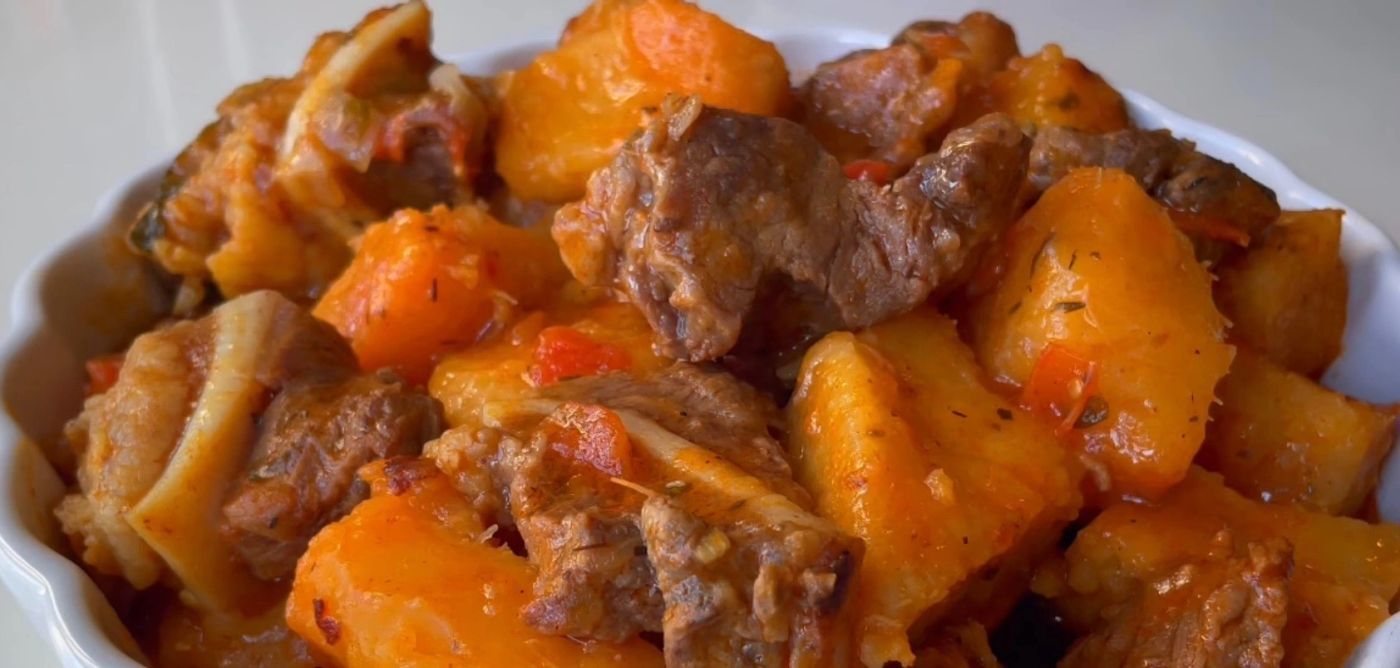 Hearty stew of beef and potato chunks in tomato sauce